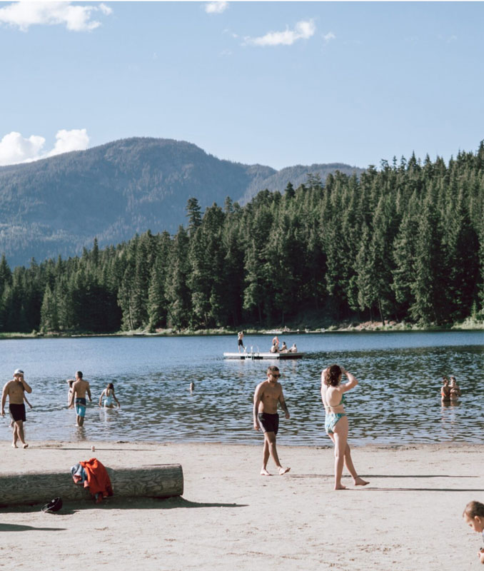 Benchlands Whistler park with people hanging out in the summer